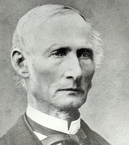 en svartvit bild på en äldre man från förr.